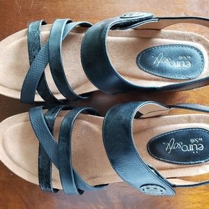 Black leather wedge sandals